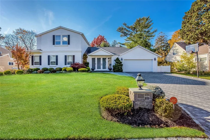 Welcome home to this immaculate, expanded ranch style home in the Westwood Circle section of East Hills. This home offers a unique style with the primary bedroom, bath and bonus sitting area/office on its own level. Walk in through a recently renovated foyer that leads to an open floor concept- Living room flowing into a beautiful den with stone covered wood-burning fireplace and mantle. Large eat-in kitchen, powder room and laundry on first floor. Three oversized bedrooms on main floor. Finished basement with gym. Sliding glass doors lead to a beautifully landscaped, fenced in yard. 2 car garage fully equipped with electric car-charging station. Roslyn School District. Membership to the East Hills Park & Pool. An absolute must-see!