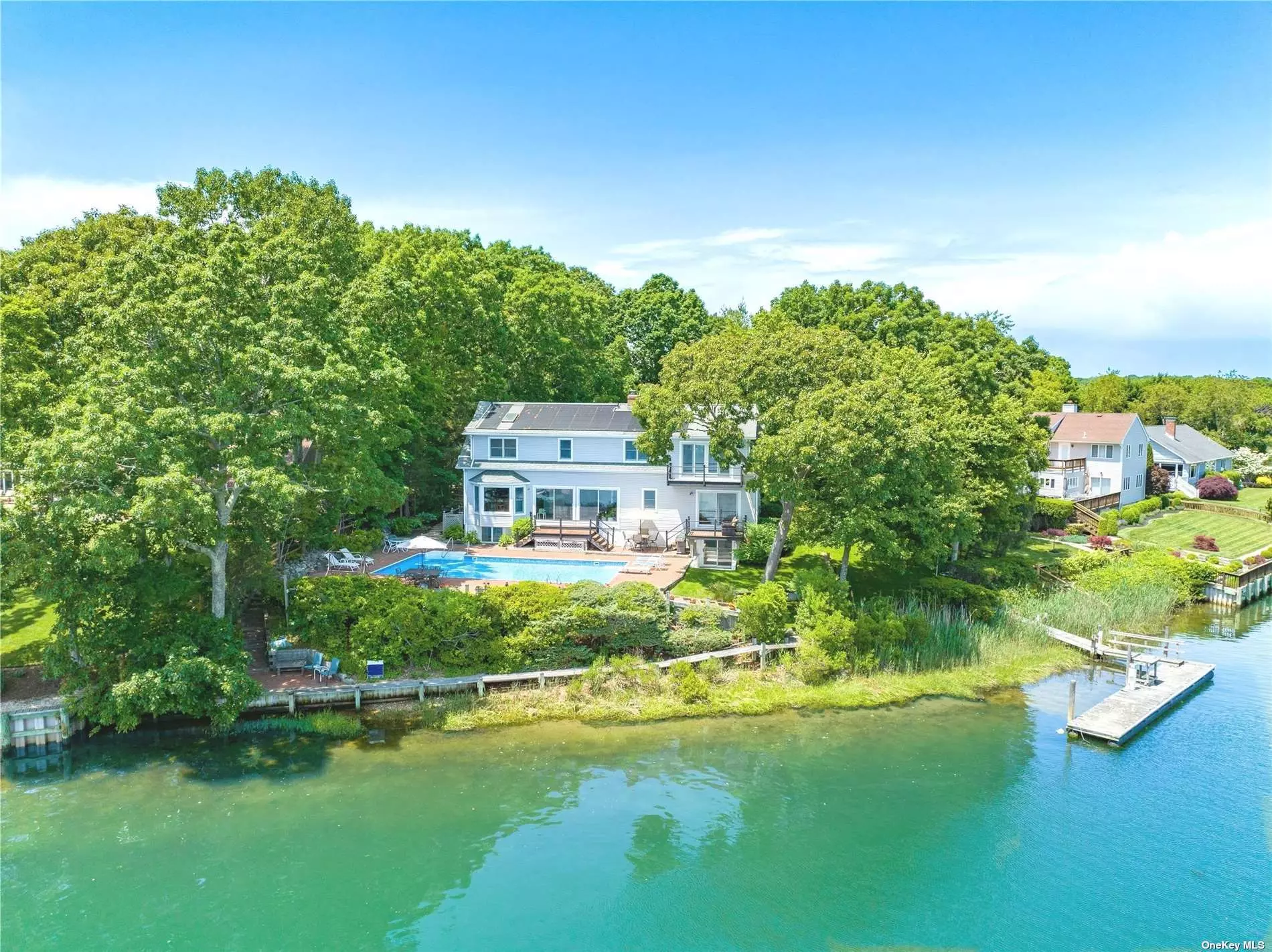 Perfectly Sited Waterfront Home with Heated Pool, Deep Water Dock and Community Bay Beach. Direct Open Views Across Gull Pond to the Bay Beyond. Water Side Seating Area and Catwalk to Access the Natural Shore Line for Fishing or Wading in the Water. 169 Feet of Water Frontage. Room For All with 5+ Bedrooms and 4 Full Baths. Livingroom with Fireplace. Primary Suite with Balcony Overlooking Pool, Dock, Gull Pond and the Bay. Fully Finished and Legal Basement Area with Game/Family Room, Separate Office/Den with Full Size Window, Wet Bar Area, Full Bath and Direct Access to Pool. Marble Baths, Steam Showers and Jacuzzi Tubs too. Radiant Heat in Several Rooms. View the Virtual Tour or Floor Plan Attachment. A Must See Property!