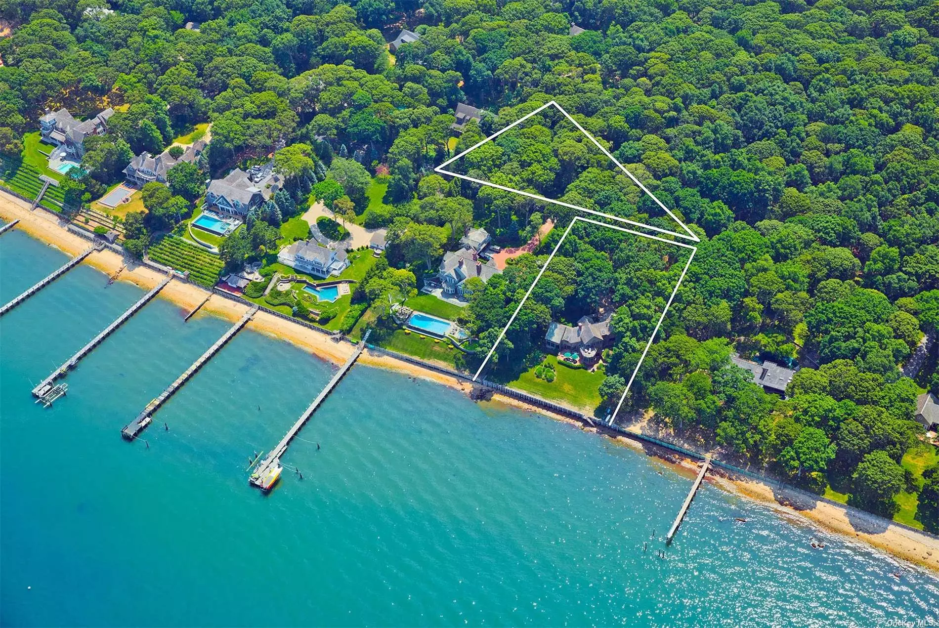 Panoramic Waterfront Gem in North Haven Spectacular North Haven waterfront! This spacious 5 bedroom, 4 bath home offers complete privacy with panoramic views of Shelter Island Sound and Mashomack Reserve/Shelter Island. Sited on over an acre of waterfront property, 168&rsquo; +/- of private beach with new bulkhead, steps down to a secluded beach ideal for swimming, kayaking, paddle boarding, and boating (dock pending). Expansive living room with impressive brick fireplace and oversized windows offering spectacular views. Watch the sunrise over the water from virtually everywhere on this stunning property. Discover a new route to your favorite places by boat in Greenport or Salt Restaurant and Ram&rsquo;s Head Inn on Shelter Island. Truly a boater&rsquo;s paradise. Renovate existing our build new up to 6, 000+/- sq. ft. Additionally, there is a .76+/- acre lot available at $1, 100, 000 to create your own compound. Only 2 miles to the heart of historic Sag Harbor Village.