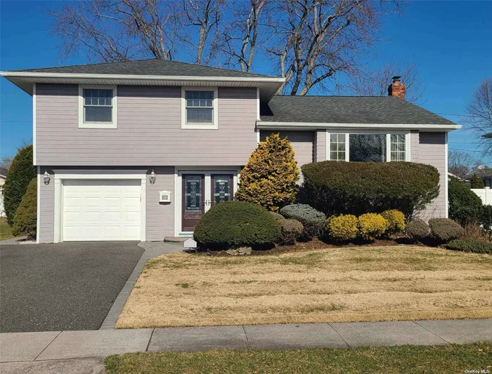 Picture living in this updated and well maintained home on a quiet street in Plainview. This middle of the block split boasts 3 bedrooms, 2 baths, den and 1 car garage. The main floor is designed with an open concept kitchen, formal dining room, formal living room with a cathedral ceiling, large windows and southern exposure. Full basement is partially finished with walk in closet, laundry room, utility room and plenty of storage. Go outside from kitchen or den to a spacious paver patio in a large backyard setting that is perfect for entertaining. Updated Anderson windows and doors, roof, hot water heater, central air, furnace, inground sprinklers, alarm system with central station monitoring and plenty more.