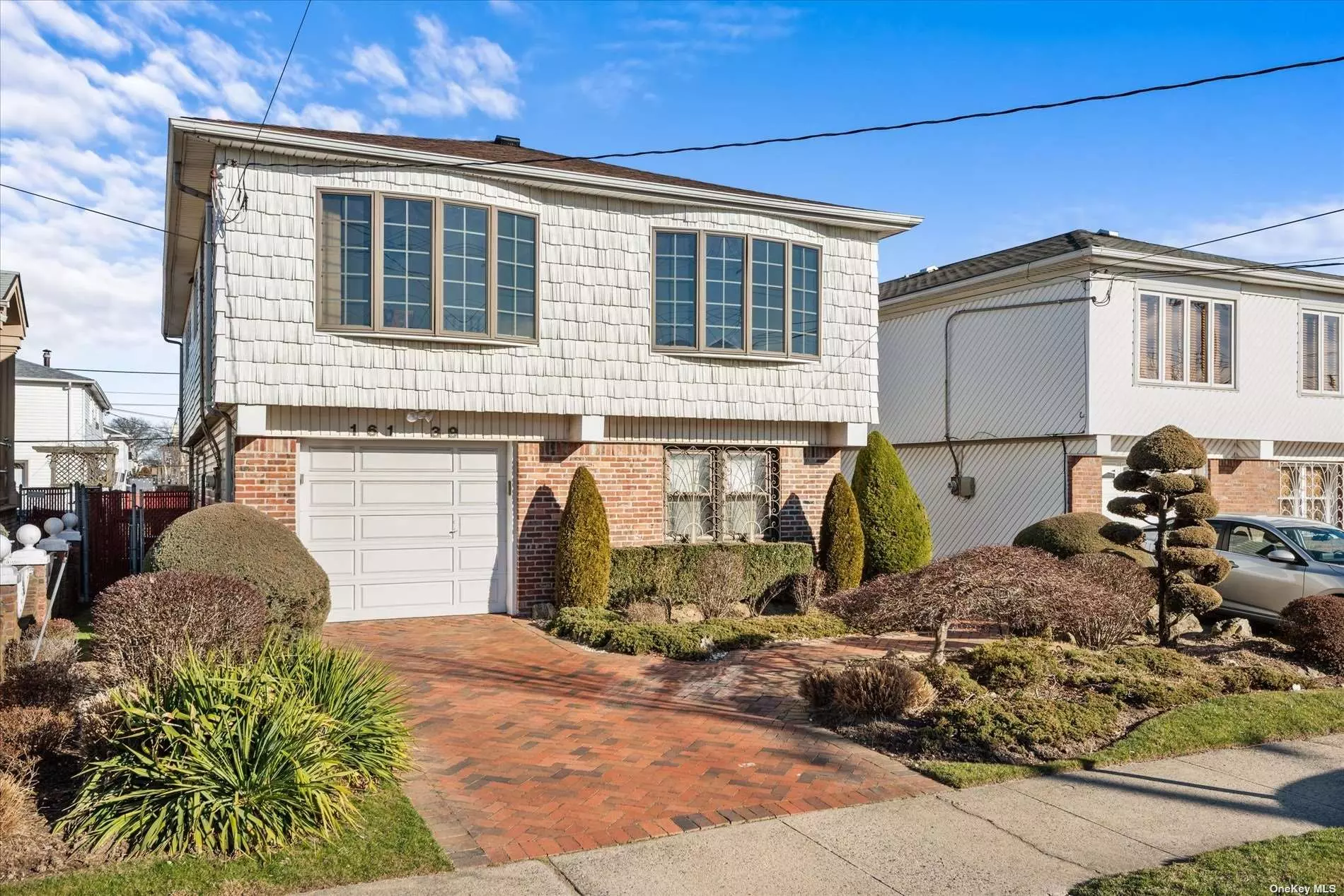 Hi Ranch in the heart of Howard Beach. Home features 4 bedrooms, 3 baths, living room, dining room, EIK. New roof and new boiler.