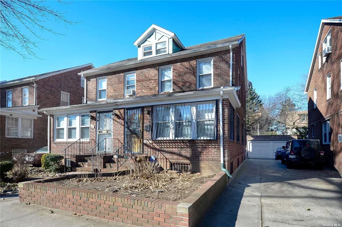 Spectacular Semi- Attached Forest Hills Brick Colonial. Conveniently Located Near Public Transportation and Shops! Main Entrance Leads To Living Room And Formal Dining Room. Custom Made Kitchen With Granite Countertops and Granite Floors. Second Floor Holds The Master Bedroom, Two Additional Bedrooms and A Full Spacious Bathroom. Third Floor Has A Spacious Bedroom and a Full Bath! Separate Entrance Basement- Fully Finished With Family Room And A Second Custom Made Kitchen! Lovely private yard, Long Driveway Leads to One Car Garage. A Rare Listing In A Very Sought After Neighborhood, A Must See!!