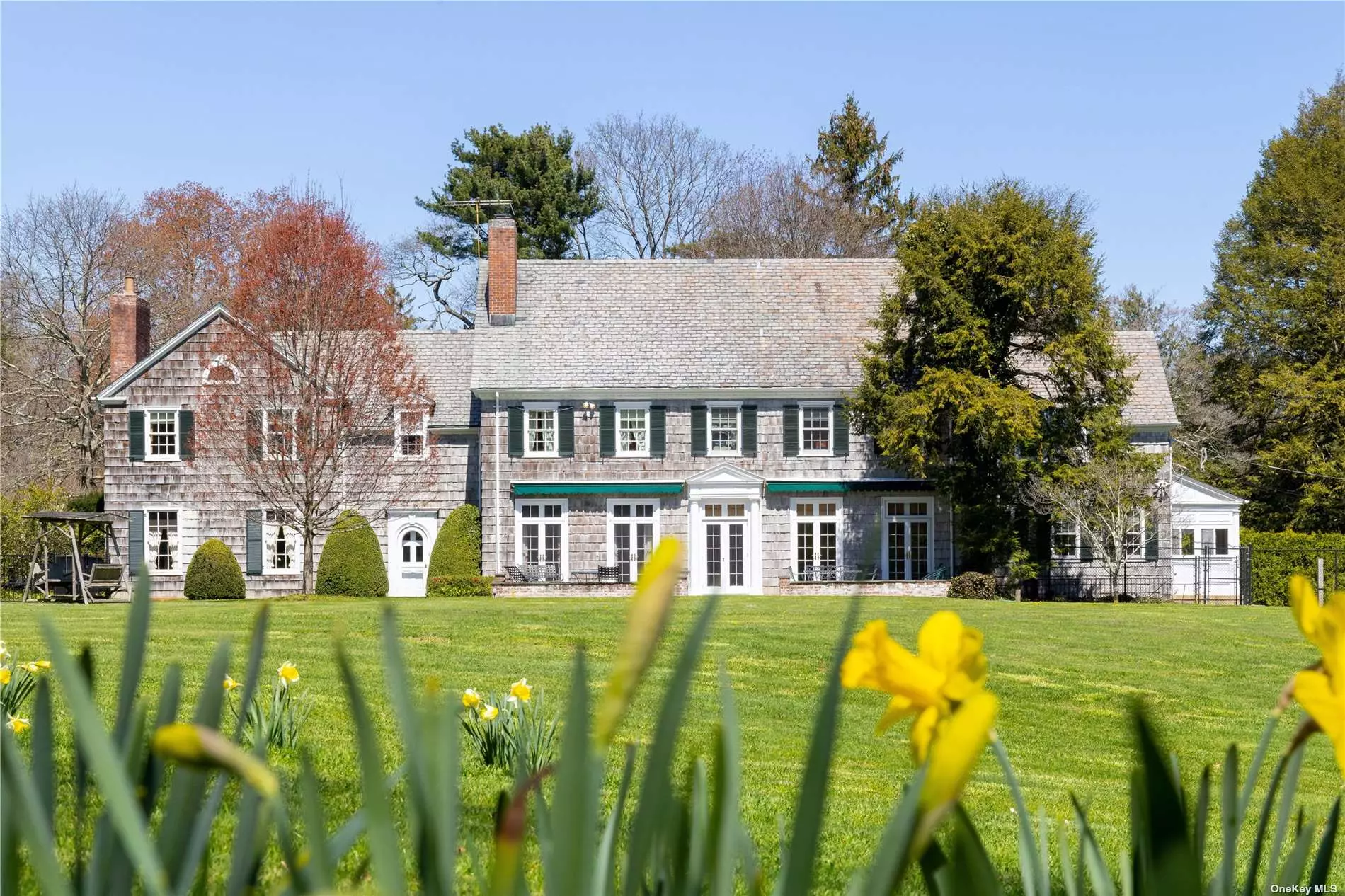 This house was featured in Country Life May 1939 as the home of John Noble Stearns. At the Entrance to this Estate is a Classic two Bedroom Cottage, three car Garage and Stables. A long tree-lined driveway leads to the six bedroom Colonial built in 1933 by Architect James O&rsquo;Connor with Innocenti and Webel landscaping. Incredible 15.2 flat acres with pool and tennis court are all situated in 2 acre Zoning with road frontage on Wheatley Road. Buyer could consider a possible subdivision and discuss with village.