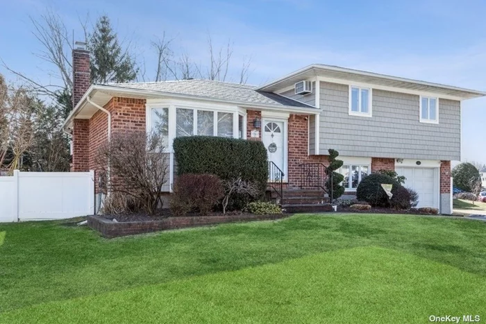 Don&rsquo;t Be Late Or You Will Miss This Immaculate Updated Split. Start At The Curb & Notice The Attractive Shingle Like Vinyl Siding. As You Enter Notice How Aesthetically Pleasing The Handsome Wood Floors Are. The Floor Plan Is Open And The Rooms Flow Seamlessly Into Each Other. Perfect For Entertaining. Kitchen Stylishly Updated Is Open, Bright And Airy , Vaulted Ceiling And Skylight Brings In The Sunshine. Pretty Granite Counters Cover Large Island/Breakfast Bar. Of Course Gas Cooking /Heating. Generous sized Br&rsquo;s . Impressive Updated Baths Main Bath Lets The Light Shine In Through Crystal Clear Skylight. Den Is A Fabulous Room To Gather Beautiful Flooring And 2nd Updated Bath Has Pedestal Sink. Nice And Cozy Finished Basement . This Home Defines The Phrase Squeaky Clean