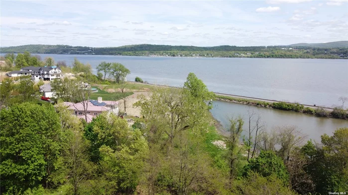 Embrace the opportunity to create your ultimate haven overlooking the Hudson River and the Newburgh/Beacon Bridge within the prestigious Marlboro School District. Spanning on 1.1 acres, this remarkable lot offers breathtaking views surrounded by million-dollar+ homes. With private waterfront access, enjoy paddle boarding or kayaking right outside your door. Conveniently located just minutes away from wineries, restaurants, orchards, farmers markets, transportation and much more. This property is exactly what you have been waiting for. With New York City a mere 1.5 hours away, you can enjoy the best of both worlds. Land financing options available through one of our preferred lenders.