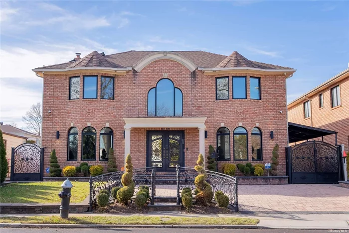 A Stunning Brick Contemporary House located in Fresh Meadows. This home has about 5150sf in lot size and 2, 740 sf interior space with 5 bedrooms and 5 full baths. First floor features a double-story entry foyer with custom wrought iron exterior door, open Kitchen w/ book matching counter-tops and Italian custom cabinets paired with high-end appliances, it also includes a guest room and a full bath. Second Floor features a Master suite with Master bath, walking closet, additional 3 bedrooms with a Full bath. Additionally, the house contains a fully finished basement with family room, recreational area, and a Sunna room. Radiant Heat Floors Throughout the whole house, venetian paint on most public area wall, central vacuum, central AC, Outdoor Pool and Much more! SD # 26.