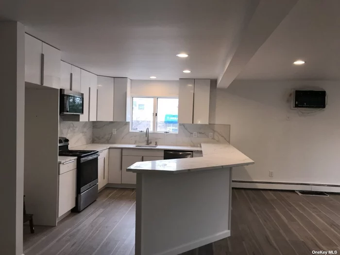 Fully Renovated Modern Apartment in Building. Open Floor Plan. Den W/ Fireplace, 2 Bedrooms, 2 Bathrooms, Washer/Dryer, 1 Car Parking