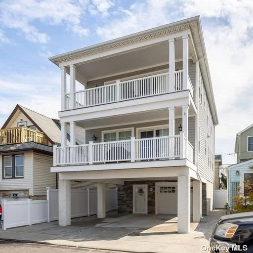 SPECTACULAR 3BR, 2.5 BATH-NEWLY CONSTRUCTED-OCEANVIEW-WESTERN EXPOSURE 2- SUN FILLED DECKS-5 HOUSES FROM OCEAN BEACH-WIDE BLOCK(BEACHSIDE)-PRIVATE COVERED MULTI CAR DRIVEWAY-OPEN CONTEMPORARY LAYOUT-SHAKER CABINETS W/ GRANITE COUNTERS