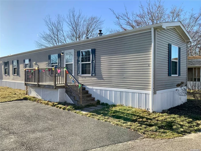 55+ Community located in the heart of Riverhead. Easy access to all the Northfork has to offer, shopping, restaurants, wineries, farm stands, golf, boating. Well maintained 6 year young home. 2 Bedroom, 2 Bath, Laundry area, Propane heating & cooking, CAC.Pet friendly community (not to exceed 45 pounds). 2 car Driveway. All buyers must be approved by Lakewood. $919.50 per month includes: lot rent, water, garbage, snow removal & cesspool maintenance.