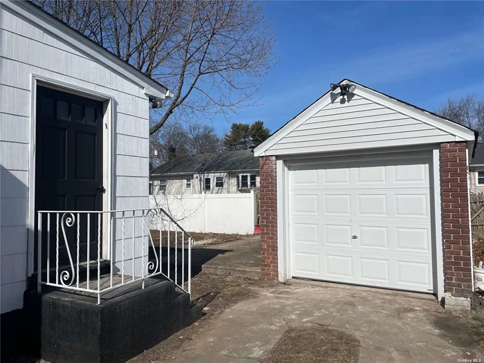 View of Detached Garage & Side entrance to one bedroom