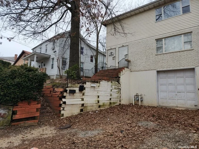 Legal 2 Family in Glen Cove with 3 bedrooms and 2 full baths in each unit. First floor unit has a basement. House has a 1 car attached garage not contiguous with no interior access. Property has been fully winterized. No warranties on property condition. Cash deal or 203K loan perfect for this one. Sloping property with a 2nd tier area of backyard.