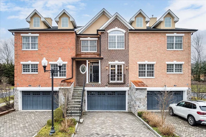 This stunningly designed and expertly crafted brick townhouse in the sought-after boutique community of 32 townhouses, The Preserves built in 2006. This spacious townhouse boasts an impressive 4 Beds  3.5 Bath  3600 square feet across three levels, offering ample living space. Enveloped in classic brick all around, the exterior makes for an inviting and charming curb appeal. Step inside and discover a meticulously designed home featuring four generously sized bedrooms and inviting space for entertaining.. The townhouse also features an elevator, making it easy to access all levels of the home with ease. The two-car garage provides ample space for cars and storage, adding a layer of convenience to your everyday life. The Preserves is a private townhome community completed with a plethora of amenities such a clubhouse gym, movie theater, party room, and walking trails along the scenic pond. Being in the desirable Woodbury community, conveniently located near major transportation hubs, shopping, and the Syosset school district!