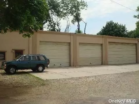One Double Garage Space ( lNote 3rd Door on the right as pictured) w/storage, 1 office space and 1.bathroom. 2 parking spaces in front of garage. Office has a split air system, garage has forced air heat. Overhead exterior garage door is 11&rsquo;, interior height is 14&rsquo;.