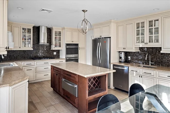 A mint updated split style home on the coveted ABC&rsquo;s. This 4BR+ 3.5 Baths home consists of close to 3000 Sq Ft of living space on a 9000 Sq Ft Lot. Fully Kosher Eat in Kitchen with granite countertops, SS appliances, 2 Sinks, 2 Kitchen aid dishwashers, 2 GE ovens plus a warming drawer. Matching bay windows in front and back that overlooks yard, 2 zone Gas Heating, 2 zone CAC, Hardwood Floors t/o. 2 options for Master, Top Master suite is 23&rsquo;6x 19&rsquo;7 with 2 walk in closets, Custom Kiwi closets in each BR, 4 inch HH t/o home. New navien on demand heating system, Vast basement which makes a great play area, Andersen windows throughout , Roof is 7 years old 2 sheds in backyard plus deck, quiet  block, close to homes of worship, shopping, and LIRR taxes after star 9628!!