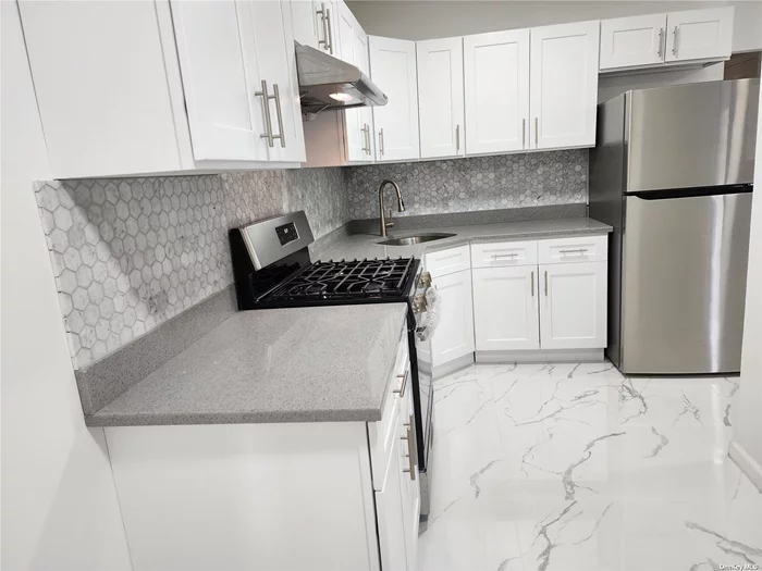 Recently Renovated Bright Place, Interior Space is 1, 280sf. All Appliances are New, New Granite Counter Top, New Refrigerator, New wall Mount Air-conditioning, These Buses in front house Q27, Q65, Q17 take you to Main St. #7 Train only 12mins. The Owner Pay 50% All Utilites-Elec, Gas, Heat. Ample of Street parking Near, Private Parking $100 Month.