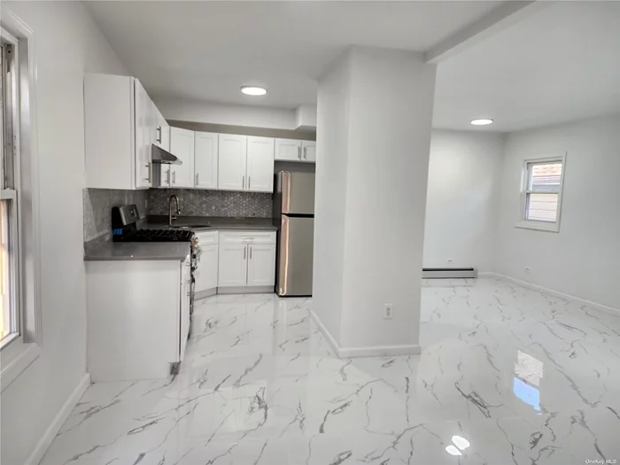 Recently Renovated All, Interior space is 1, 280sf,  All Appliances are New, New Refrigerator,  New Granite Counter Top, Wall Mount Air-conditioning,  These Buses in front of House Q27, Q65, Q17 take you to Main St #7 Train only 12 mins., Owner Pay 50% All Utilities-Elec, Gas, Heat. Small Pets Possible, Ample of Street Parking Near, Private Parking $100 Month.