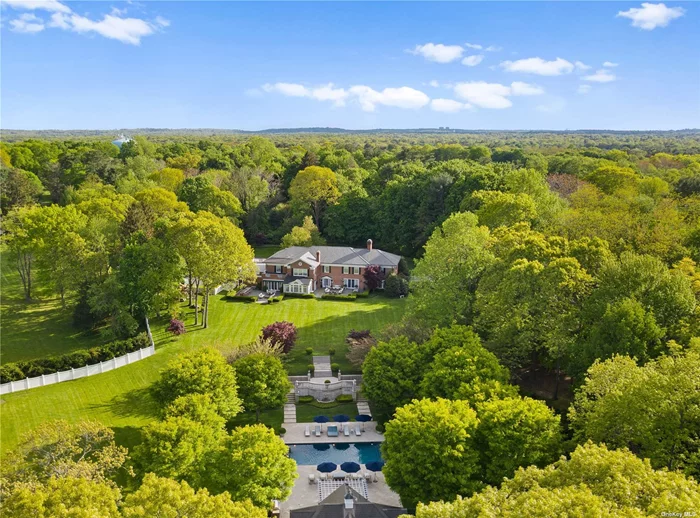 This exceptional 8 bedroom brick Colonial residence is set on 8.11 prime acres in the Village of Matinecock. Hideaway reflects a classic & gracious style with luxurious amenities & floor plan for today&rsquo;s living. Built in 1971 & completely renovated in 2015, this stately property has been meticulously maintained. Principal rooms are generously sized with 11ft ceilings, offering views of bluestone patios & impeccably manicured hedges & gardens. Lower level features media room w/ gas fpl, billiard/game room w/ gas fpl, wet bar, 2beds w/ en suite baths, art studio, playroom, wine cellar & fitness room/gym. Outdoor space showcases multiple patios, 2 built-in grills/1kitchenette, golf hole w/ tee boxes, tennis court, heated saltwater pool w/ electric cover, fabulous pool house w/ eat-in kitchen, 2beds w/ en suite baths & full lower level storage. App-based Savant Pro smart technology system & generator. A truly magnificent country estate w/ an abundance of amenities & privacy!