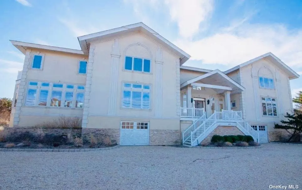 Waterfront Luxury! Sprawling Oceanfront home on prestigious Dune Rd. Sun-filled and spacious w/1st and 2nd floor master suites. This home has open floor plan with chef&rsquo;s kitchen, top of the line appliances, large dining room, over-sized living room w/fireplace, 2nd floor den w/fireplace, and 3 additional en-suite guest bedrooms. Generous mahogany decking surrounds heated pool with spa. A private walkway to the Ocean completes this resort-like setting.