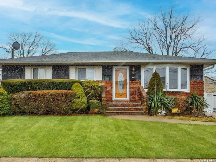 Beautiful Bethpage ranch. Mid-block location. This home features an eat-in kitchen with tons of wood cabinets. Good size living room and dining room. Hardwood floors throughout most of the house. Some updated windows. Ceiling fans. Attic storage. New heating system (2 zones). 275-gallon oil tank in the basement. Finished entertainment room basement with separate entrance. Inground sprinklers, front and back. One car detached garage. Nice sized fenced-in yard. Taxes are listed without the STAR exemption. Bethpage school district.