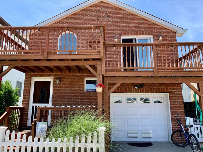 West End Beachside Contemporary House with Garage. Open Livingrm-dining area-kitchen w/breakfast bar--granite counter & s.s. appliances. 3 bedrooms, 2.5 baths. 3 decks. Washer/Dryer. Close to Beach, Boardwalk, shops & restaurants.