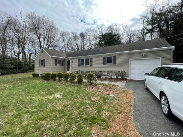 Like New Home, Updated Kitchen, Siding, Windows, Roof and Bath- Set Back with spacious grounds for a serene lifestyle.