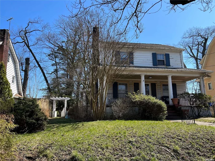 Welcome to This Charming 3 Bedroom Colonial Style Home Located in The Prestigious Community of Jamaica Estates. The Buyer Is Greeted With an Inviting Southern Front Outdoor Porch, Upon Entering The Front Door Experience A Spacious Living Room With A Brick Wood Burning Fireplace, Huge Formal Dining Room For Entertaining 12-15 Guests & Family, Adjacent Sun-Filled Family Room Or First Floor Bedroom, Office, Large Eat-In-Kitchen With A Mud Room And Access To The Rear Yard, Powder Room, Second Floor: Primary Bedroom, Two-Family Bedrooms, Full Bathroom, Attic, Lower Level: Large Open Space For Entertaining, Utility Room, Storage Room, Laundry, Half-Bath, Property Features: Large Wood deck, 2-Car Garage, Close To Schools, St. John&rsquo;s University, Fine Dining, Public Transportation, LIRR, Highways and Local Airports. Build Your Dream Home or Renovate This Classic Colonial.