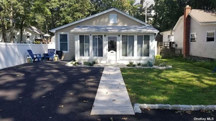 Two Bedroom Cottage close to the beach w added bonus room - New driveway and fenced backyard - Completely Updated including Paint, Kitchen, appliances, Bathroom, Flooring and fully furnished. STEPS TO BEACHWITH PERMITS