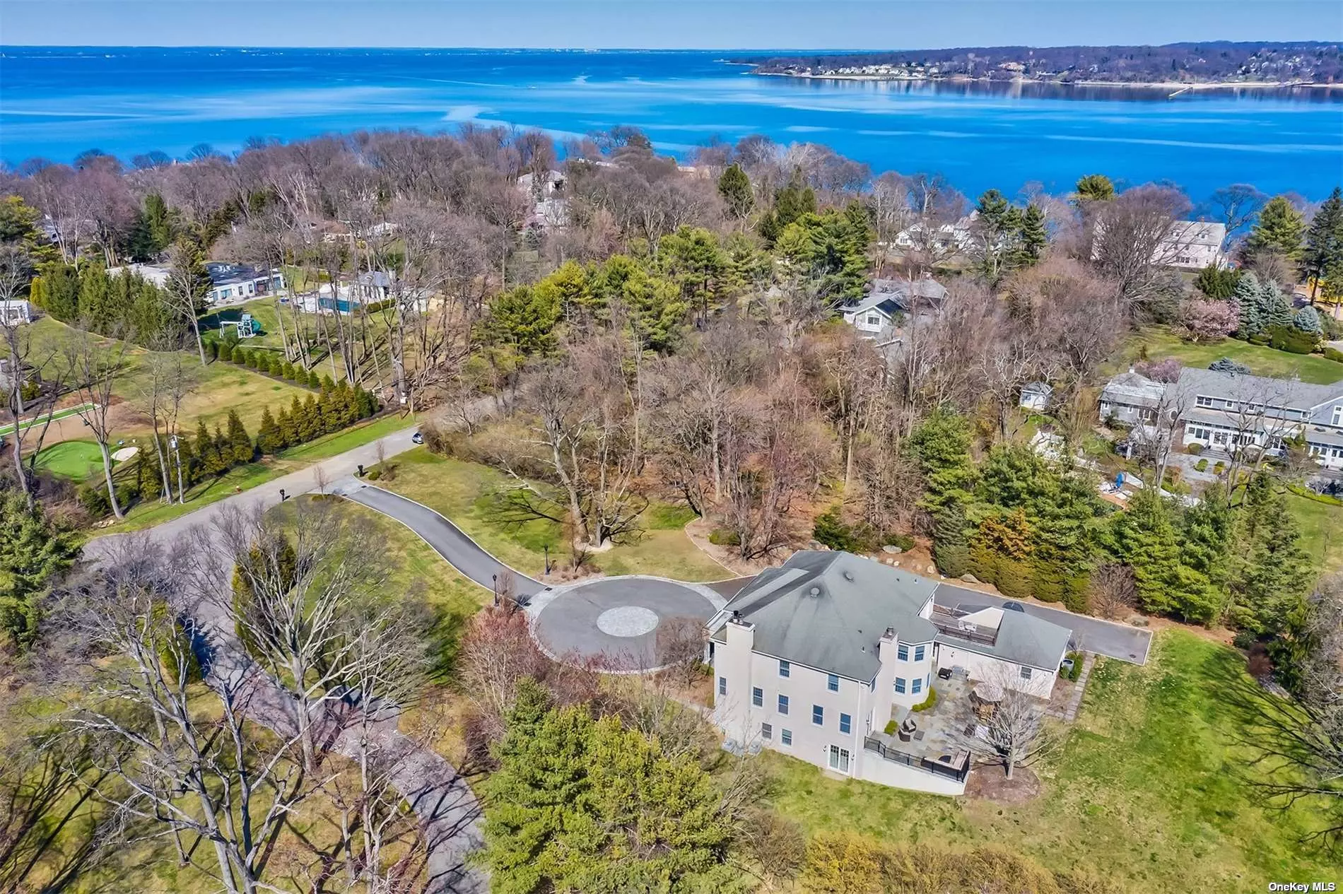 This 2004 Colonial, situated on two park like acres, on a quiet Sands Point cul-de-sac has been recently refreshed and is ready for sale. An impressive approach with key-hole driveway and original NYC lampposts leads to this very special custom-built home. Beautiful, traditional architectural details are combined with contemporary well thought out spaces, making this home ideal for today&rsquo;s modern lifestyle: 7 bedrooms, 5 full bathrooms, and 3 half baths. The main level features a double height entry, formal living room with wood burning fireplace, generously sized and bright formal dining room, chef&rsquo;s kitchen with access to large bluestone patio, butler&rsquo;s pantry, oversized den with wood burning fireplace and patio access overlooking the meticulous grounds. Mahogany paneled home office, two powder rooms, laundry room, mud room and three car garage. The second story is home to the primary suite with large his and hers walk in closet and spa-like bathroom with steam shower and outdoor balcony. Four additional second story bedrooms (two with en-suite bathrooms) and an additional full bathroom complete this floor. The lower level of this expansive home is a world unto itself with two bedrooms, one full and one half bath, cedar closet, wine room, recreation area, homework room and vast amounts of storage space, along with walk out access to the beautiful grounds overlooking the Village Club of Sands Point. Whole house humidification, air filtration, and water filtration systems.