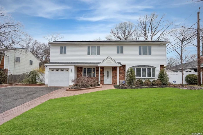 A Colonial located in the desirable Tulipwood area of Commack. Home is bright and spacious with an open layout. First Floor features a large Entry Foyer with a large coat closet, formal Living room and Dining room, eat-in kitchen, separate Laundry room leading to a 1 car Garage, Powder room (.5 bath) the Heart of the Home is the cozy family room with rustic stone wall fireplace perfect for relaxing with oversized Sliding door leading to large outdoor living space designed for Entertaining, featuring a built-in bbq area with TV, In-ground heated peanut shaped saltwater pool. Second Floor has 4 spacious Bedrooms all with custom California Closets, main full bathroom. Primary Bedroom featuring a Huge Walk in Closet, Private Bathroom and Office. This Energy Efficient home has Led Lighting throughout and Solar Panels, High Efficiency Natural Gas Boiler, Security Cameras, Attached 1 Car Garage, In-ground Sprinkler Beautiful Landscaping, Full Finished Basement with Utility Closet. Many Resent updates.Making this your private summer Oasis. This Home is a Must See ... Won&rsquo;t last, call today!