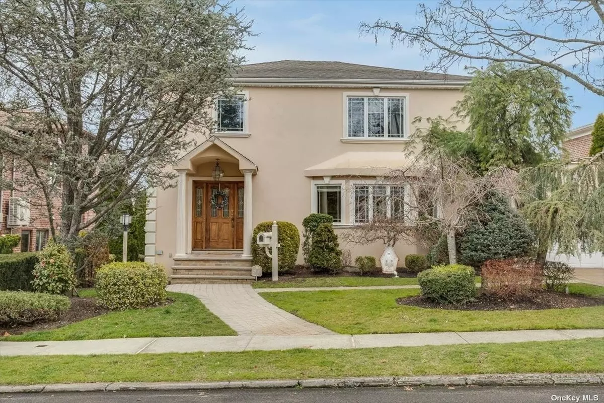 Welcome to this stunningly renovated large colonial home featuring four bedrooms, two full baths, and two half baths. The custom-made kitchen cabinet is complemented by stainless steel appliances. Hardwood floors run throughout the house. The recessed ceiling lights, alarm system, and central air conditioning with two zones and three heating zones will provide year-round comfort. The dining room features sliding doors that open onto a huge patio with stairs leading to the backyard. You&rsquo;ll find a heated pool surrounded by beautiful trees, a patio, and a fence - perfect for relaxing and entertaining. The fully finished basement offers open space, a laundry room, a half bath, and a door to the street-level backyard. The private driveway leads to a one-car garage. You&rsquo;ll be conveniently located near the Bay Terrace shopping center and just a short walk from the Cross Island Parkway Trail. School District #26. This house is a must-see!