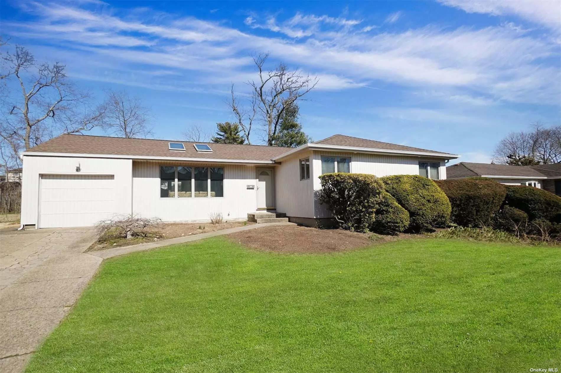 This ranch is located in the East Birchwood section of Jericho. The home offers a spacious living room with a vaulted ceiling with skylights and great entertainment space as it flows into the dining room with French Doors that overlook the yard. The kitchen and den also have French Doors leading to the yard. The primary suite is generously sized with it&rsquo;s own en-suite bathroom. You will also find beautiful wood floors throughout, central air conditioning and a finished basement. The yard is beginning to bloom with flowers, perimeter plantings and mature Azaleas.