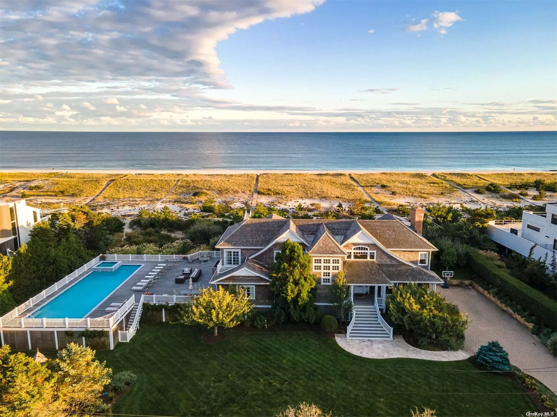 Located within Dune Road&rsquo;s coveted &rsquo;Between the Bridges&rsquo;, 175 Dune Road offers 225&rsquo; of sprawling ocean frontage. The 1.94 acre property sits among rare double dune & jetty protection, and features a 20&rsquo;x60&rsquo; gunite pool & spa, upper & lower oceanfront decks & ample lawn. The first level offers a grand foyer & living room leading to lower decking, luxurious ensuite master, 5 additional bedrooms & 4 full baths. The upper level features a light filled great room, dining room & vast, fully equipped gourmet kitchen, all with unrivaled views of the Atlantic Ocean. The upper level is replete with powder room& 7th bedroom, which is ensuite with private balcony overlooking the bay. Outdoor highlights include a double head outdoor shower with changing room, private walkway to the ocean & deeded right of way to the bay. Endless upgrades include a large 2021 renovation, smart home capability & much more! This spectacular property was buiit in 2007 and is not located within a flood zone.