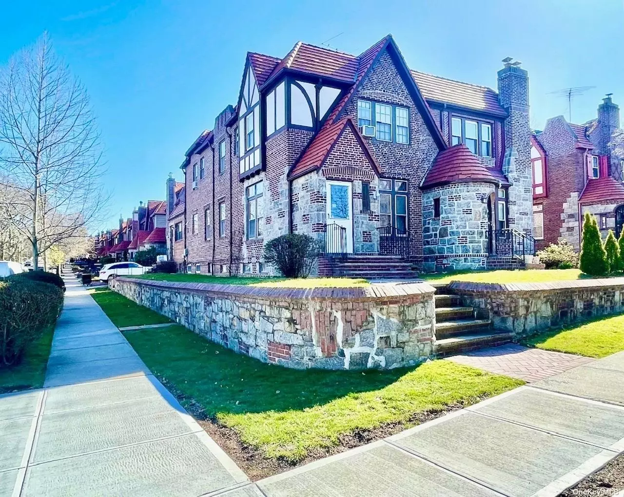 This Charming Tudor Home Located in Bayside Hills. Features 3 Bedrooms, 3 Bathrooms, Living Room with a Wood Burning Fireplace, Formal Dining Room, Den, Eat in Kitchen. This One Dwelling Home Has Two Different Entrances, The Main Entrance at 48 Ave. The Second Entrance at 217 Street. The Large Full Finished Basement Offers An Impressive 12Ft High Ceiling And Second Fireplace. This Home Provides Suburban Tranquility Within The Midst Of The City. Close to Shopping, Restaurant & Transportation. Convenient To Northern Blvd, LIE 495 & LIRR Station.