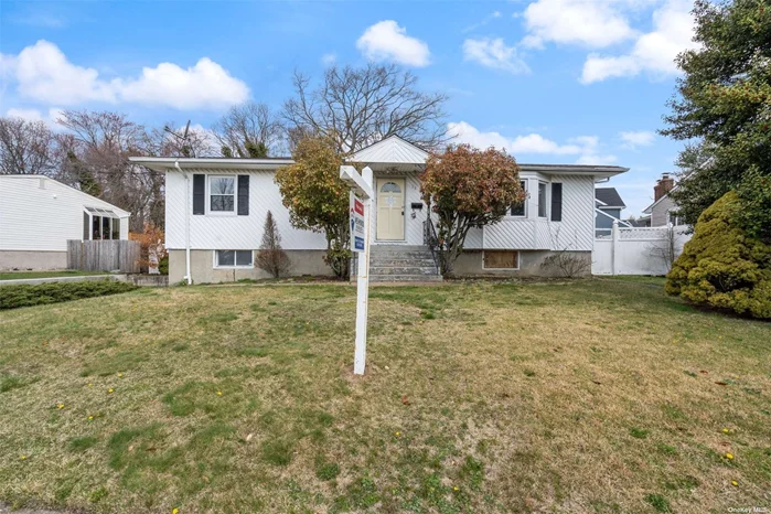 Ranch style home with updated kitchen, finished basement and 2 car attached garage. This home is located mid block on a residential street. This home is just a couple blocks from sunrise highway for convenient and quick access to other major roads.