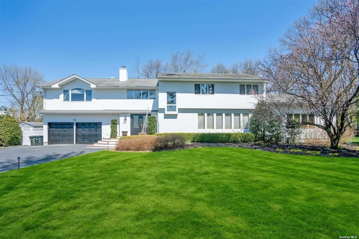 OPEN CONCEPT COLONIAL LOCATED IN THE HEART OF NORTH SYOSSET WITH 5 LARGE BEDROOMS, NEW KITCHEN, PAID OFF SOLAR SYSTEM HEATS SWIMMING POOL, NEW ROOF FROM 2017, BEAUTIFUL BACKYARD WITH A IN GROUND HEATED SWIMMING POOL, 2 CAR GARAGE