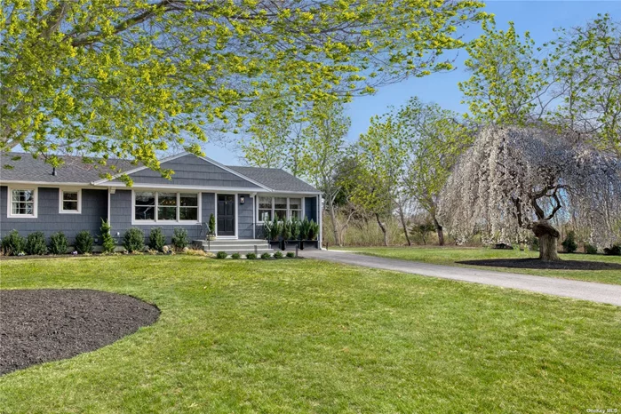 Privacy and serenity abound in this pristine Southold mid-century inspired ranch in the exclusive Southold Park District at 855 Grange Road, Southold. Impeccably designed, this elegant 3 bedroom/2 bath open floor plan home fully renovated in 2021/22 includes new roof, CAC, bathrooms, kitchen, living and dining room, all interior finishes, permitted finished basement with recreation room, home office, laundry room, mechanical rooms and lots of storage. Additional improvements include a new oil tank, hot water heater, driveway, and landscaping. Located at the end of a quiet cul-de-sac with breathtaking unobstructed backyard views of the vineyard vines and open fields, an ideal spot to relax on your new patio or an evening by the firepit with a glass of wine gazing at the stars. A stones throw from a Christmas Tree Farm, museums, Custer Observatory and close to South Harbor Beach, and Founders Landing, this home is surrounded by farms, wineries, a brewery, antique shops, restaurants, a perfect setting for you to call your North Fork home. This home is ready for your immediate arrival and enjoyment.