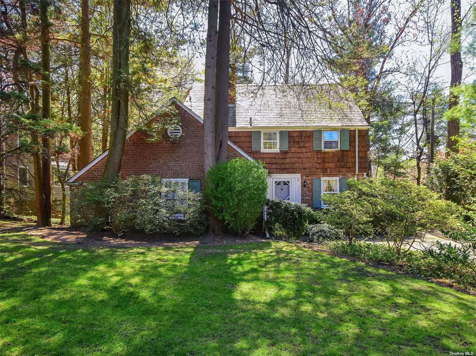 Welcome to Beacon Hill! Stately brick and cedar colonial set on a deep piece of property (.2841) 77x159. Home has some very large rooms, beautiful hardwood floors. Large LR w/ wood burning fpl and french doors leading to sunny screened in porch. Formal dining room, eat in kitchen, home office/ guest quarters w/ full bath. 2nd floor boasts spacious master bedroom and master bath, 2 additional bedrooms and 1 full bath. Lower level offers a large den w/ fpl and french doors leading to pretty slate patio. Needs some updating but great space and classic charm. Gas cooking, Oil heat, Close to schools, town, railroad, etc.