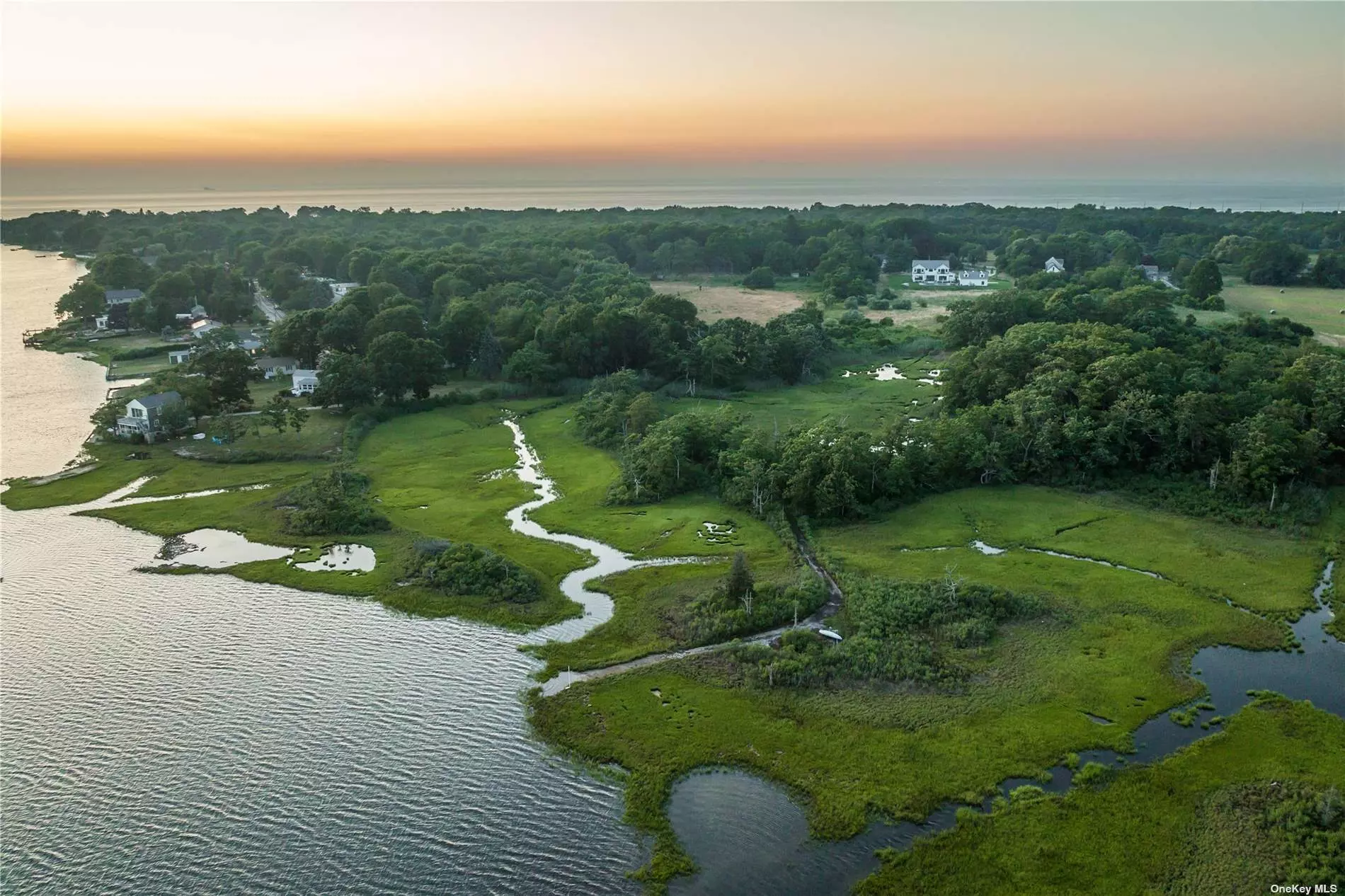 Down a graceful country road, on the North Fork of Long Island your dream home awaits. Sprawling over 13 acres with 354 feet of waterfront on Arshamomaque Pond leading out to the Peconic Bay. There is a 20 x 40 gunite pool, a barn with horse stalls should you choose or for use as an art barn! Plenty of room for tennis. Inside this magical home is an exceptional chef&rsquo;s kitchen with a Wolf range, butler&rsquo;s pantry and plenty of entertaining space - including a generous fireplace and a 3 season porch. There are two wings - one which has 3 ensuite bedrooms, including the primary suite. The other has a full kitchen, two bedrooms and 1 bathroom. This home also features a wine cellar and walkout basement. A property of this caliber does not come to the market often on the North Fork of Long Island. Let&rsquo;s make your dreams come true - this could be you!!