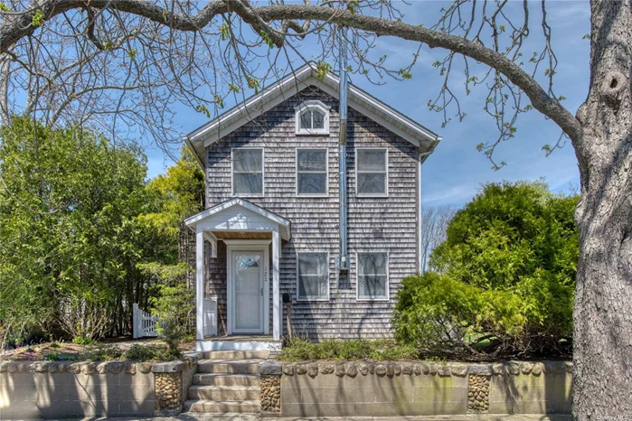 Welcome home to your quintessential Greenport Farmhouse centrally located within easy access to all of the amenities of the North Fork. Built in 1885 this home features a large open concept kitchen, dining. Spacious light and bright living room with wood burning stove. Private ensuite master with vaulted ceiling and balcony overlooking the well appointed English garden.  Greenport village shops & restaurants, library, train, jitney, sound or bay beach all within easy reach. A true village treasure.