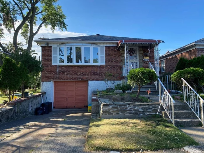 Beautiful Detached Raised Ranch In Bayside. 3 Brs and 2 Bath With Garage and Basement. Large and Bright. Hardwood Floor Through Out. Central AC. Spacious Backyard. School District #26. Close To All!