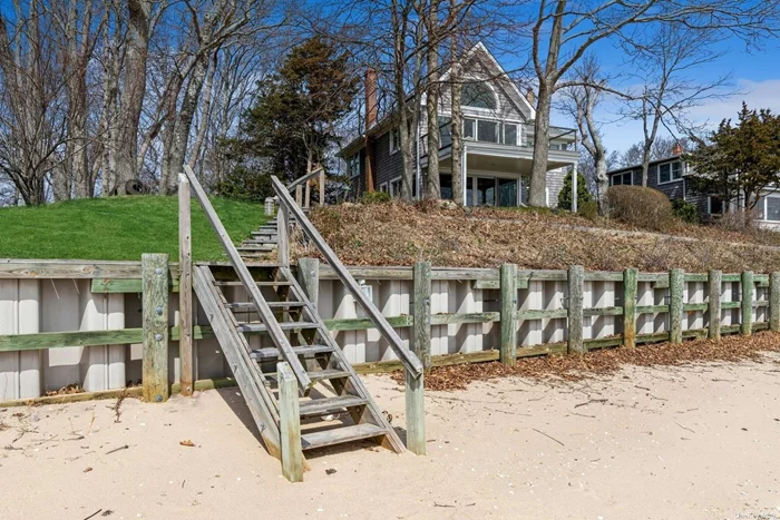 Cape-Cod-Style Cedar-Shingle House situated on edge of low bluff. Wooded lot with 2nd-story master bedroom suite/deck. Fantastic 180-degree views of Gardiner&rsquo;s Bay, Bug Lighthouse, Shelter Island, Orient Village and East Hampton with 150-feet of private sandy beach and boat mooring. Permit #0049.