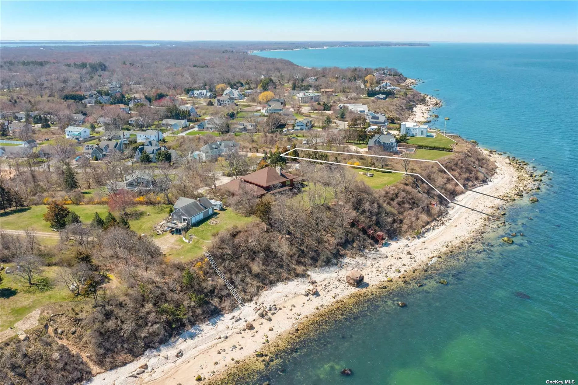 NEW TO THE MARKET! Stunning sandy beach, so reminiscent of the Greek Isles - right here on the North Fork...and you can walk the beach for miles! Shy acre property, with 104 feet of sound front beach and waterfront. Walk to town beach - 67 Steps going east and private association beach going west. Come build your dream waterfront home and enjoy the peace of magnificent sunsets, clear turquoise waters, and the excitement of Greenport village when you choose...