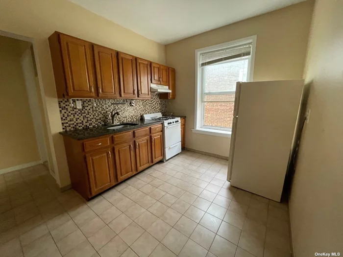 Living room, kitchen, bathroom and 2 bedrooms on second floor. New hardwood floors, freshly painted, updated kitchen and bathroom. Heat is included. No pets. Street parking. No laundry.
