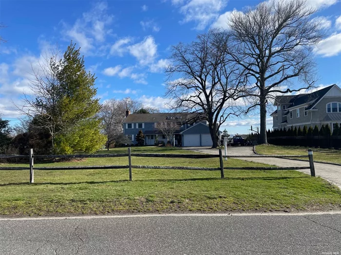 Incredible opportunity to renovate this Classic Colonial featuring 3 bedrooms 3.5 baths Formal living room, formal dining rom, eat in kitchen, family room, heated sun room, 2 car garage on 1.4 acres waterfront on the Connetquot River. Docking and small private beach!