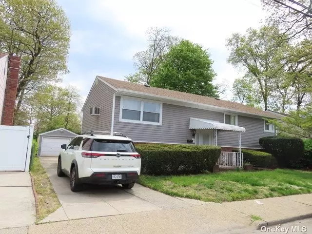 Welcome to Elmont! This lovely Hi Ranch is Centrally located on Meacham Ave in the Valley Stream 13 School District. This Spacious Home Also Features a Private Driveway & Detached Garage - Off Street Parking on Long Island is Simply A MUST!! Opportunity Awaits!