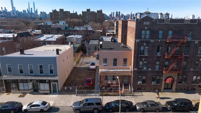MULTI-FAM TOWNHOME & HUGE, 50x100 DOUBLE LOT w/ 25x100 OF BUILDABLE SPACE! - A Rare Chance to Own 50x100 SF of Land & Double Lot w/ Existing Residential Building w/ THE Most Incredible, Totally Unobstructed NYC Skyline Rooftop Views - 2-Fam Townhome w/ 2 Renovated & Spacious Apts (1 Per Floor) Basement & Backyard Patio - 1st Floor = 2 Bed/1 Bath w/ EIK , LR & Formal DR - 2nd Floor = 3 Bed/1 Bath w/ EIK , LR & Formal DR - Partially Finished Basement w/ Walk-Out Entrance, Utility Room & Laundry - Empty Lot Beside Building is Yours to Make Use of as Your Heart Desires - i.e. Parking For Up to NINE (9!) Cars, Functional Outdoor Space, Expanded Residential Dwellings & More!  THE LOCATION/LAND: This is 2 25x100 Lots Beside One Another & Combined... Not Sold Separately! - Centrally Located on a Super Coveted, Mostly Residential Block in Prime Astoria... Just Steps to Subway, Buses, Shops, Entertainment, Some of the Very Best Restaurants, Parks, Major Highways, Airports, All Other Commerce & More - R5 Zoning - SD 30 & PS 234, AS School of Visual Performing Arts & LIC High School. CURRENT AVG RENTS: 2 Bed = $2800-$3150/Month. 3 Bed = $3000-3300/Month. 1 Outdoor Parking Spot = $275-$300+/Month (x 9 Spots!) POTENTIAL MONTHLY RENT = $8275-$8925/Month
