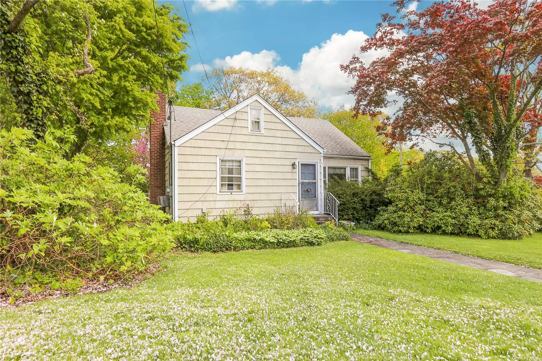 Welcome to this charming Cape-style home in the heart of Glen Cove! This lovely home boasts four bedrooms and two bathrooms, with two bedrooms and one bath on each level. As you step inside, you&rsquo;ll be immediately impressed by the gleaming hardwood floors that stretch throughout the main living areas. The large windows in every room allow plenty of natural light to flood in, creating a bright and welcoming atmosphere. You&rsquo;ll love how the sunlight bounces off the hardwood floors, giving the house a warm and cozy feel. The lush and pretty landscaping surrounding the house adds to its enchanting appeal, creating a picture-perfect scene that&rsquo;s straight out of a storybook. Everything in this home has been meticulously maintained, and it&rsquo;s neat as a pin and super clean. It&rsquo;s been lovingly cared for by its current owners. This Cape-style beauty is just waiting for you to come and make it your own. Don&rsquo;t wait - schedule a viewing today and experience the magic for yourself! It is a must-see for anyone looking for a move-in ready property with plenty of charm.