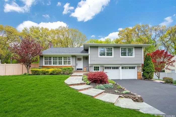 WELCOME HOME to this beautiful renovated Split in North Smithtown in Smithtown SD! Recent updates include roof, Insulated vinyl siding, garage doors & openers, main level open concept, kitchen (incl 5&rsquo;x5&rsquo; island, SS appliances, quartzite/granite counter tops) new HW floors on main level, new flooring in den and basement as well, 3 updated bathrooms, new HW Heater, newer W/D, Hi Hats throughout. Primary Suite features full bath & 3 closets. Hardwood floors on bedroom level as well. Wooded view in back of yard, 2 tier paver patio. A MUST SEE!