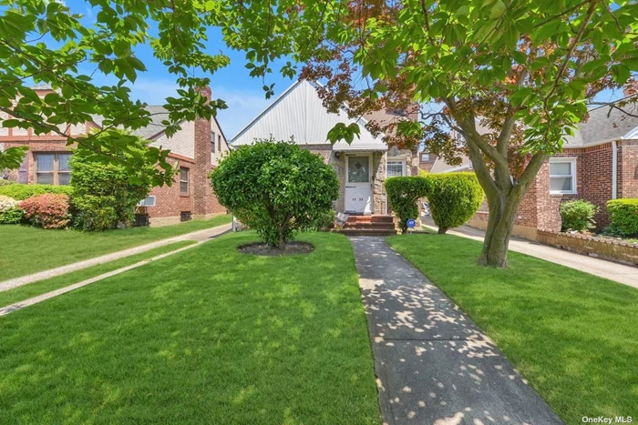 Tudoresque Cape on a Tree Lined Street in Prime Bayside. The First Floor Boasts a Foyer, Living Room with Wood Burning Fireplace, Dining Area, Updated Kitchen, Two Bedrooms, and One Full Bathroom. The Second Floor Offers Two Bedrooms, and One Full Bathroom. The Full Finished Basement Has a Family Room with Dry Bar, Laundry and Boiler Room. Spacious Sun Soaked Yard with a One Car Detached Garage. Conveniently Located Near Schools, Shops, Parks, and Numerous Modes of Transportation. R3A Zoning with Possible Expansion Capabilities (Please Consult with an Architect).