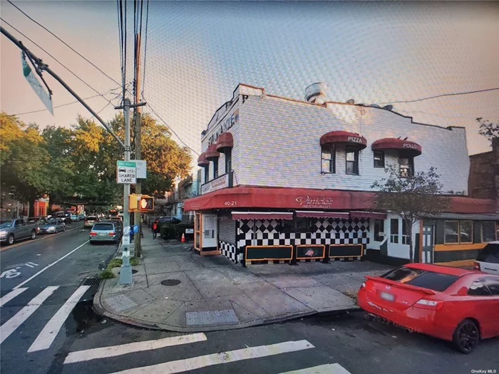 Busy Corona corner Commercial, off #7 Train on 108St. Total of 2 Apt over commercial unit ( Pizza store ).
